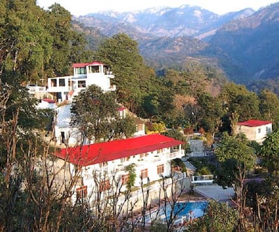 https://imgcld.yatra.com/ytimages/image/upload/t_hotel_yatra_city_desktop/v1432117318/Domestic Hotels/Hotels_Nainital/Dolmaar Resort/Exterior_view.jpg